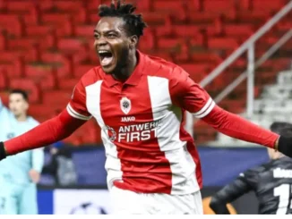 Nigerian 17-year-olds UCL Goal Against Barcelona Wins Antwerps December Goal Award   Nigerian 17-year-old forward George Ilenikhena has won the Royal Antwerp Goal of the Month for December.  Ilenikhenas late strike against Barcelona in the Champions League was picked as the best for the month in review.  The goal, which was scored in the 92nd minute, secured a 3-2 home win for Antwerp against Barcelona.  It was Antwerps only win in Group H which also had FC Porto and Shakhtar Donetsk.  Despite the win, Antwerp finished bottom of the group after just one win and five defeats.  This season Ilenikhena has scored five goals in 18 appearances in the Belgian Jupiler.  Ilenikhena was born in Lagos, Nigeria, to Nigerian parents, but he arrived in France aged only three, growing up in Antony, Hauts-de-Seine.  He first featured with France youth teams in the summer of 2021, as he was selected with the Under-16.